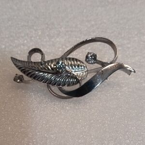 Elegant Silver Tone Brooch with Leaf Design